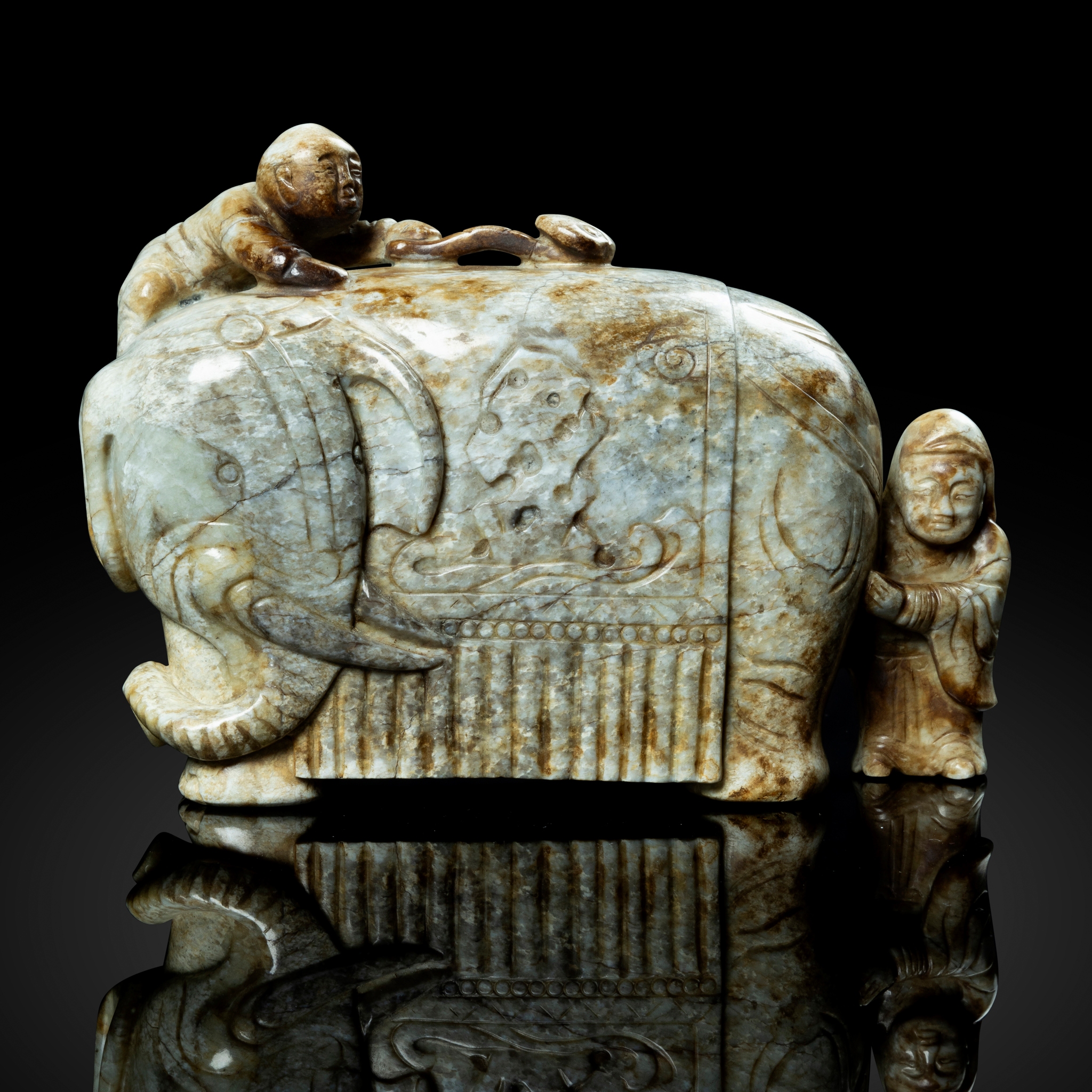 CHINESE MOTTLED CELADON AND CREAM JADE 'ELEPHANT AND BOY' GROUP