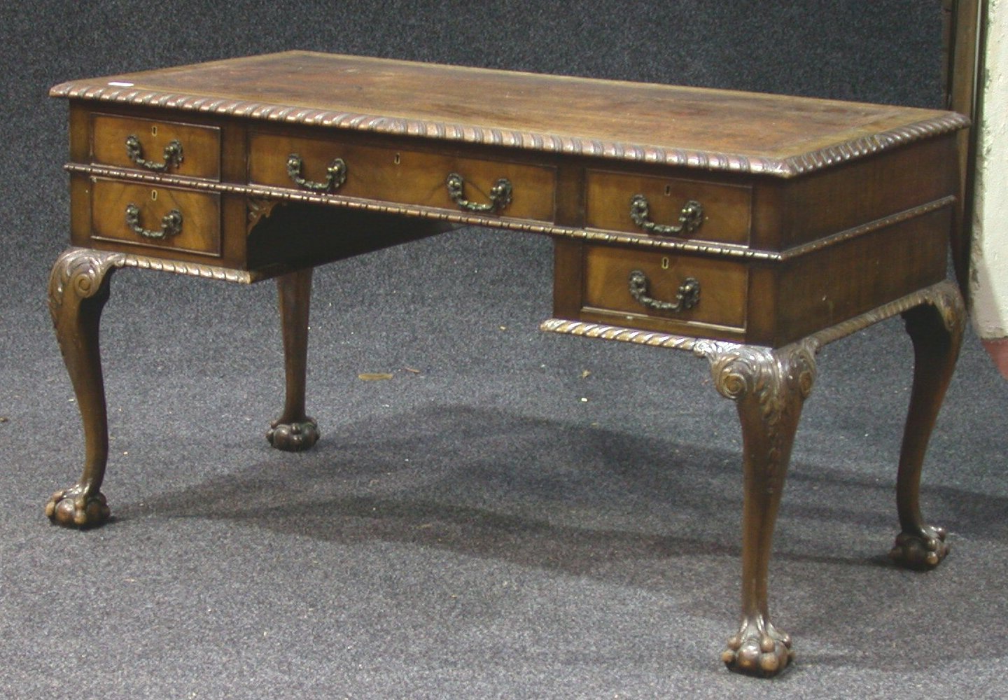 An early 20th century mahogany writing table,