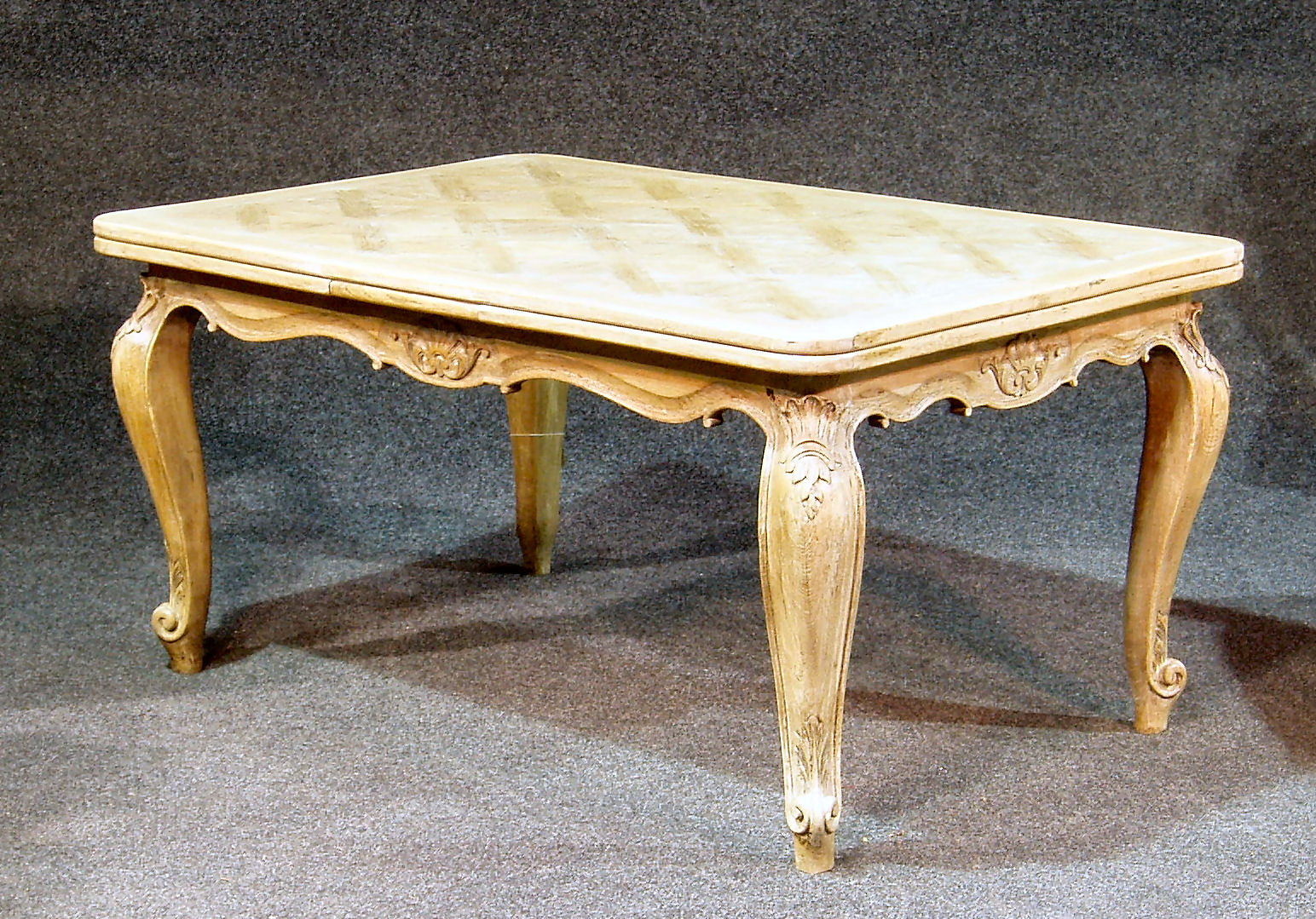 A French style limed oak dining table