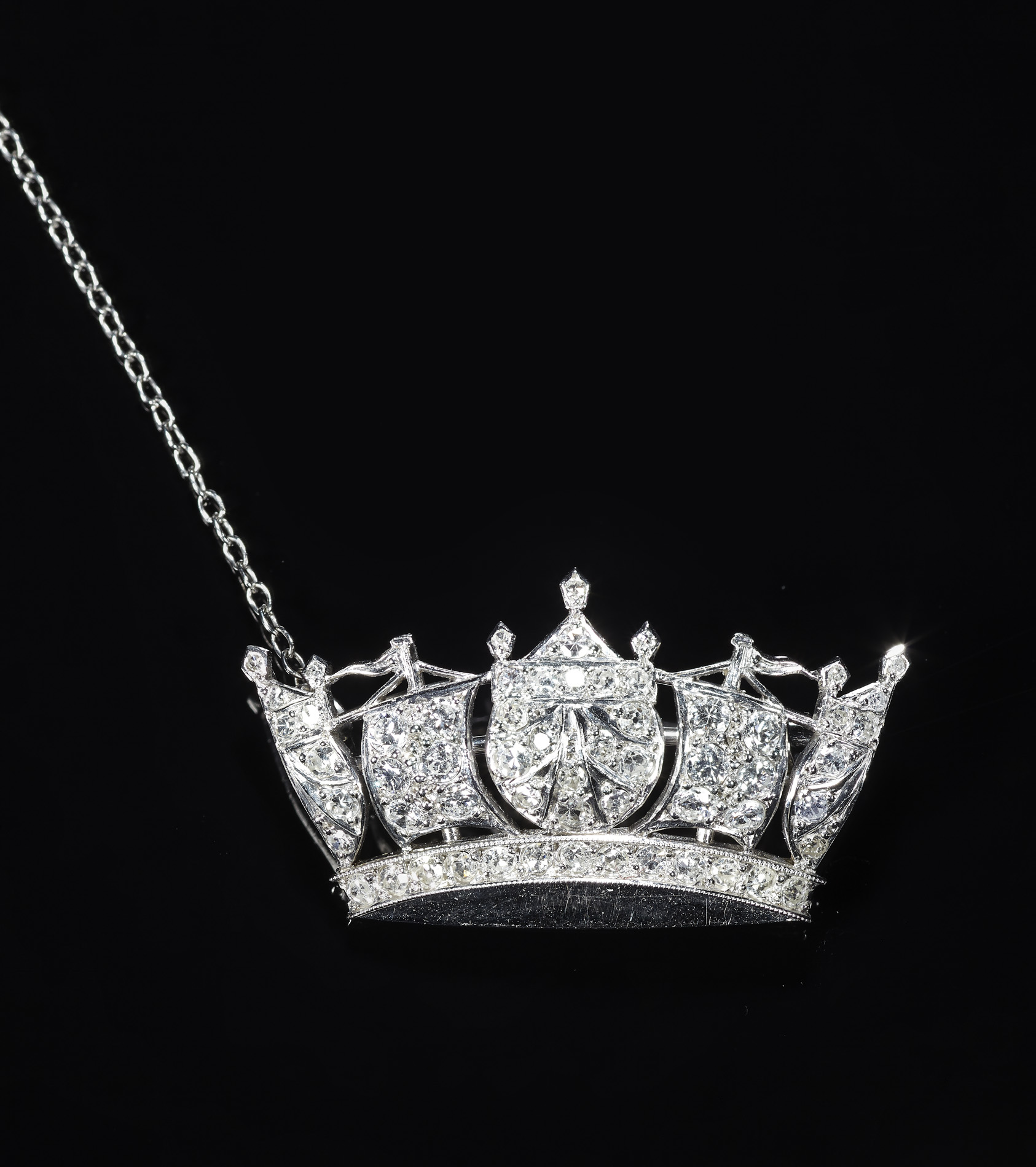 A diamond set naval crown form brooch