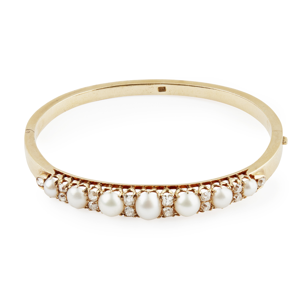 An early 20th century pearl and diamond set bangle