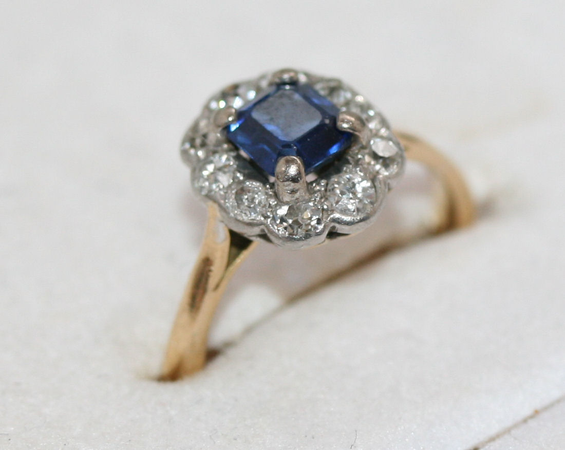 An early 20th century sapphire and diamond cluster ring