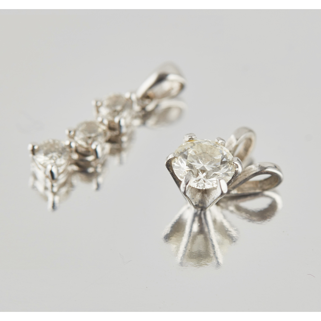 Two diamond set pendants