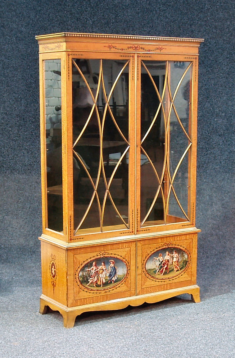 A 20th century satinwood display cabinet