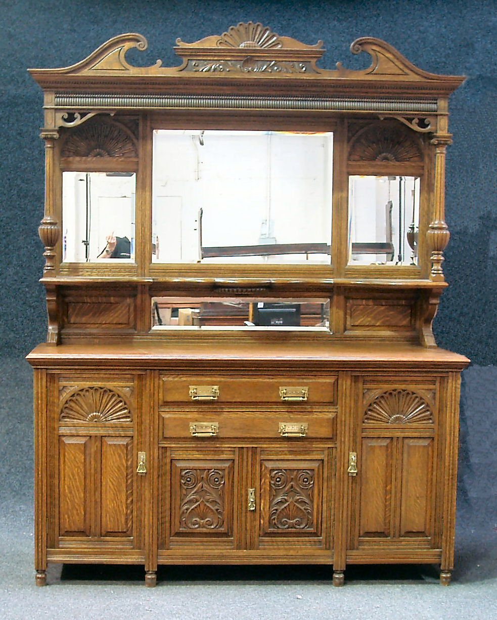A late Victorian oak mirror back sideboard