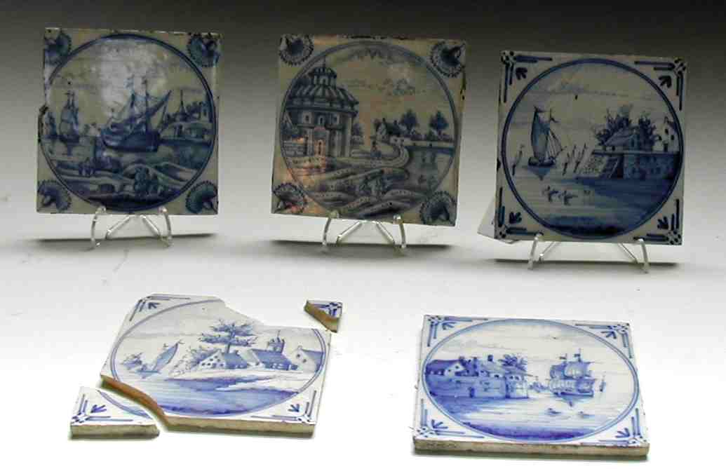 A collection of 19th century Dutch Delft chimneypiece blue painted tiles,