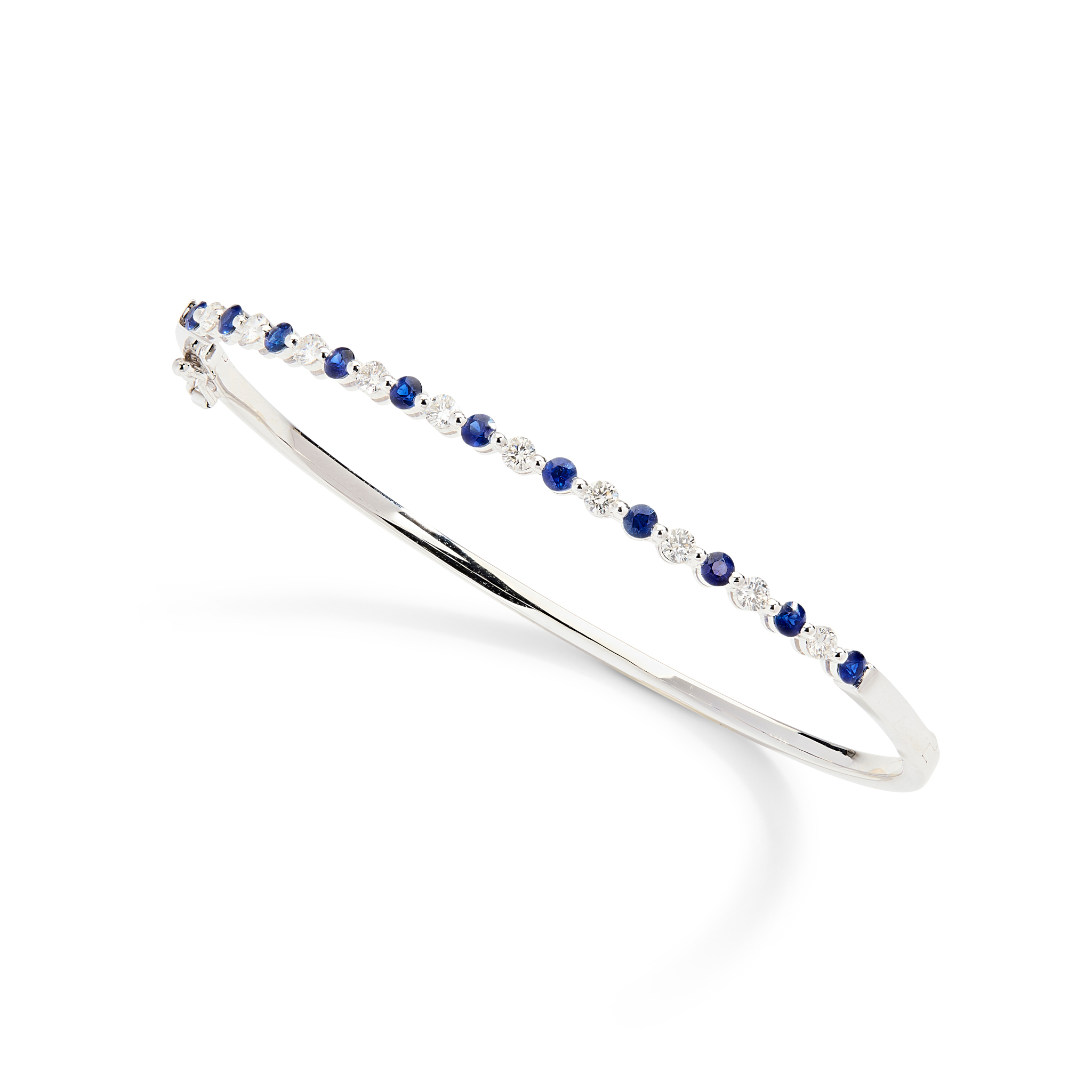 An 18ct gold sapphire and diamond bangle
