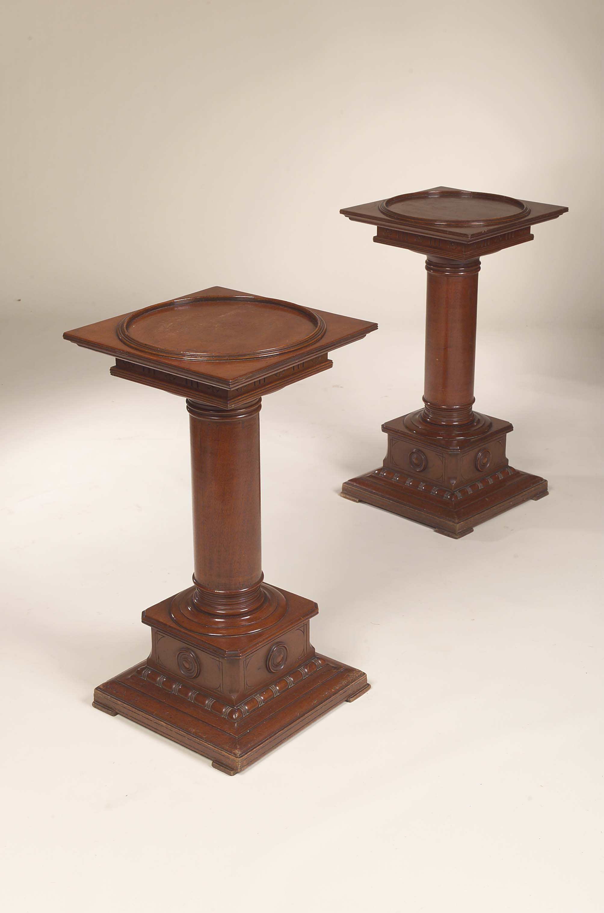 A pair of mahogany pedestals,