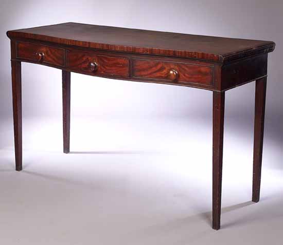 A George III mahogany serpentine serving table