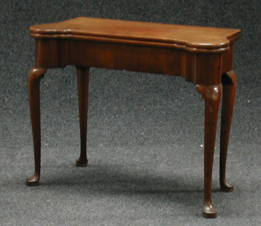 A mahogany foldover games table,