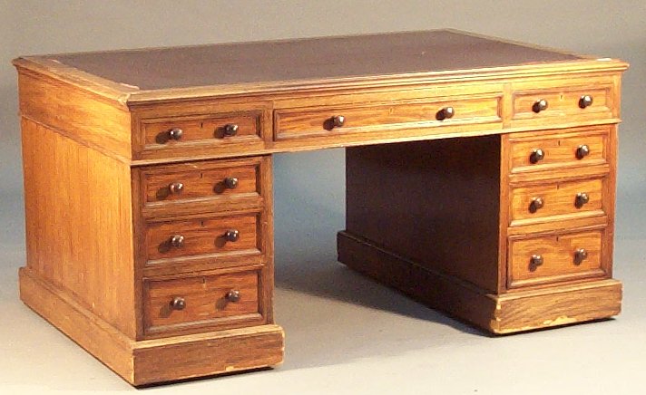 A mahogany twin pedestal desk