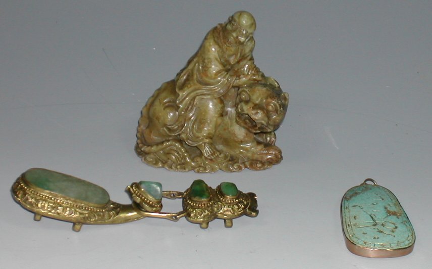 A Chinese soapstone figure of an immortal,