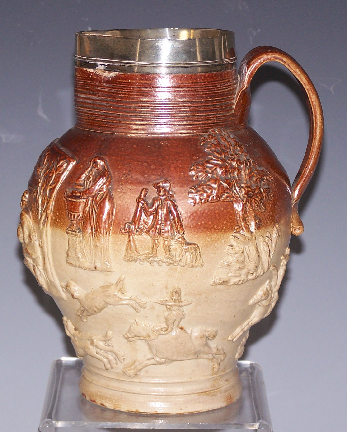 A silver mounted Doulton stoneware jug