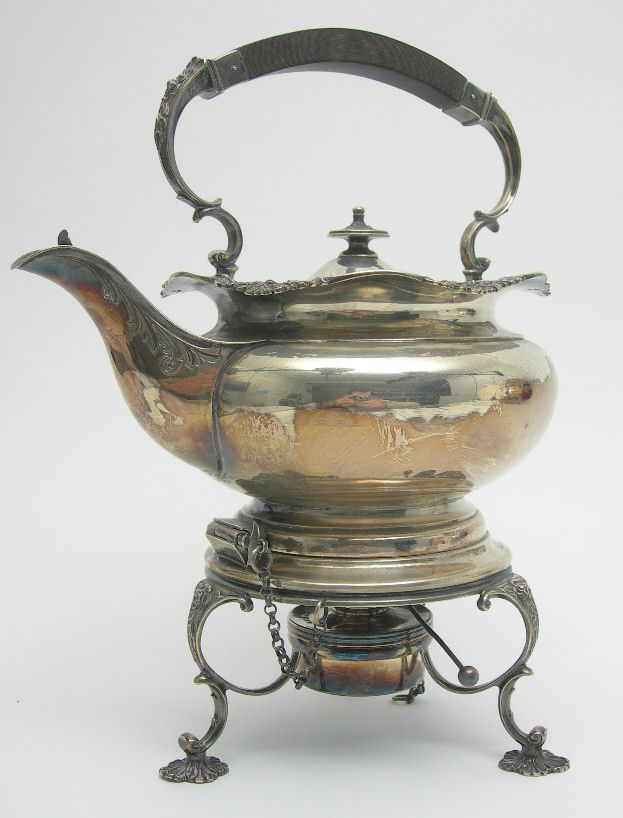 AN EDWARDIAN SPIRIT KETTLE AND STAND