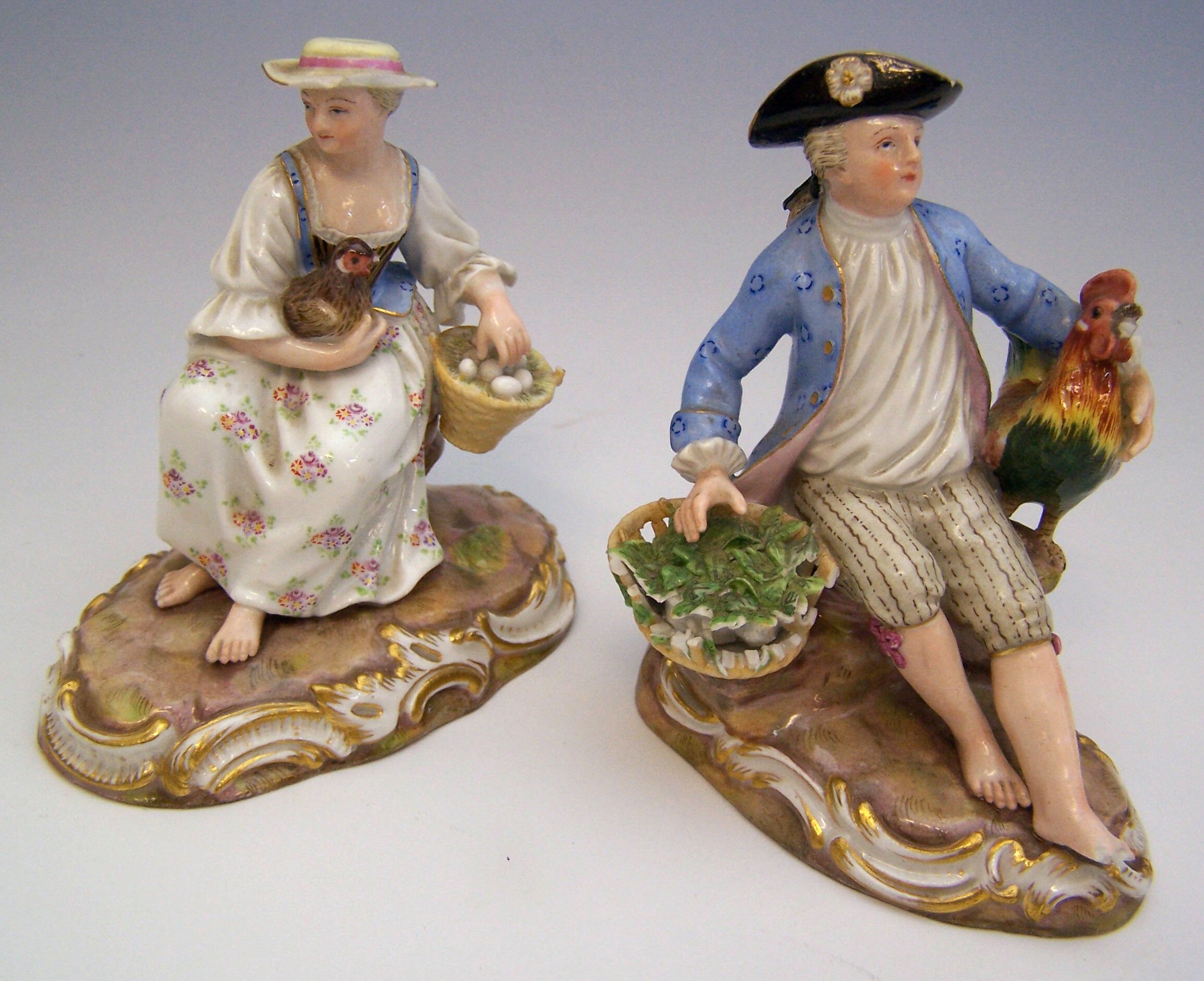 A pair of Meissen style figures,
