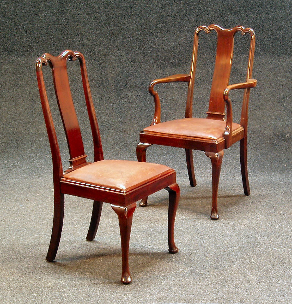 A set of ten George II style mahogany dining chairs,