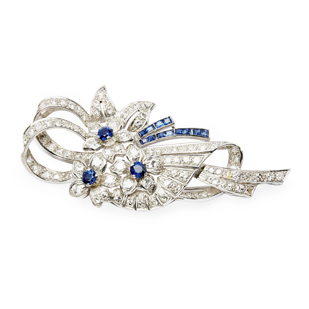 A sapphire and diamond set floral brooch