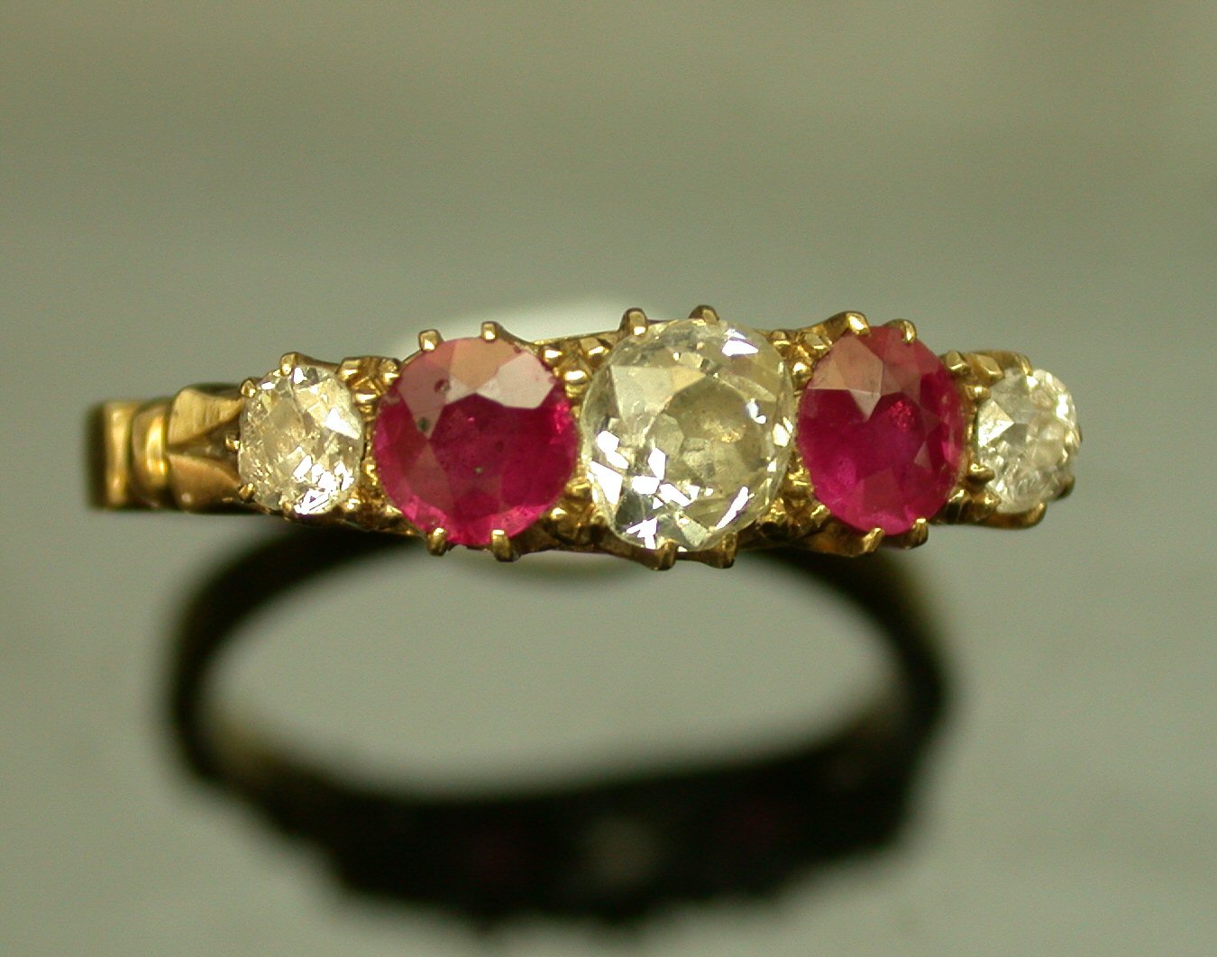 An 18ct gold mounted ruby and diamond five stone ring,