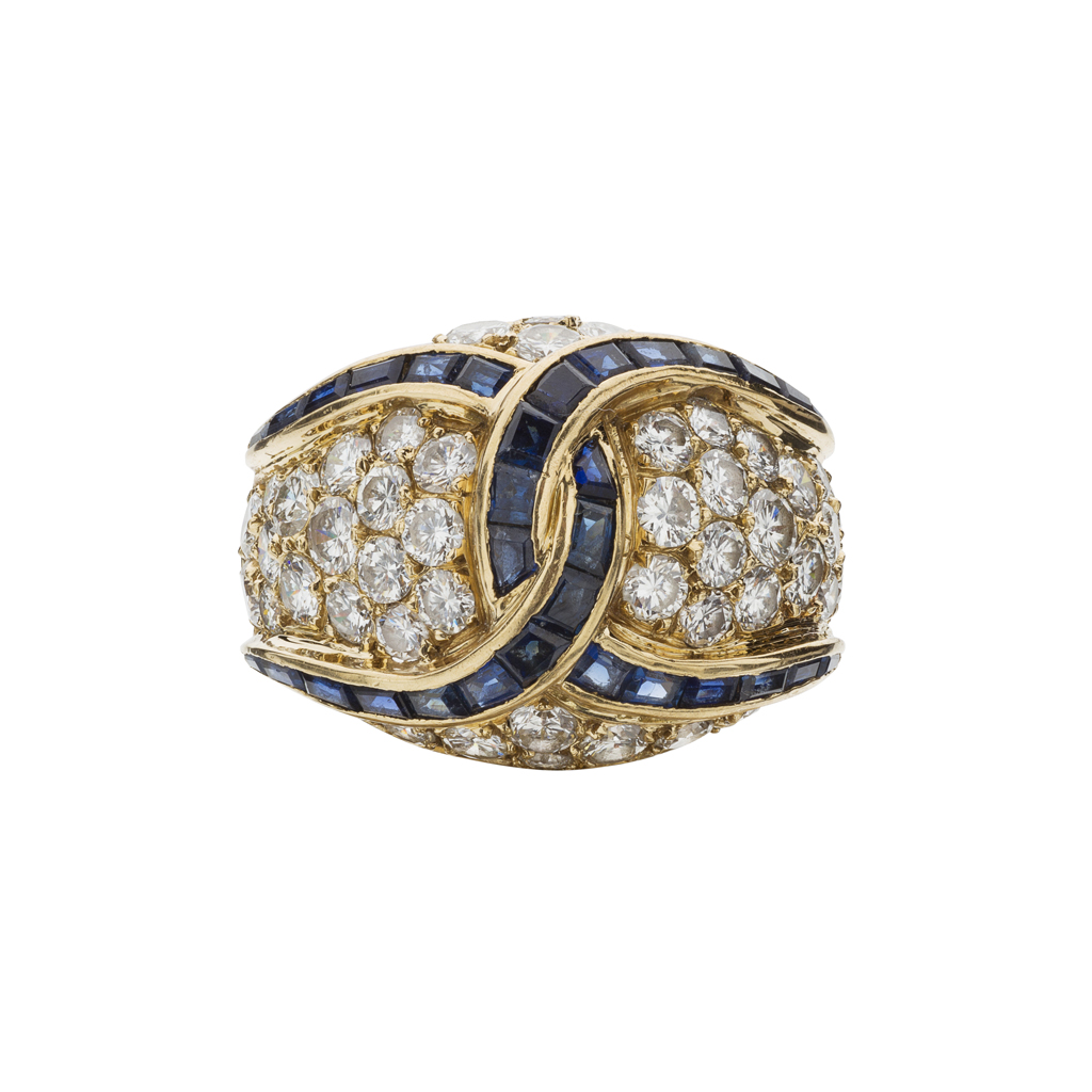 A diamond and sapphire set bombé ring
