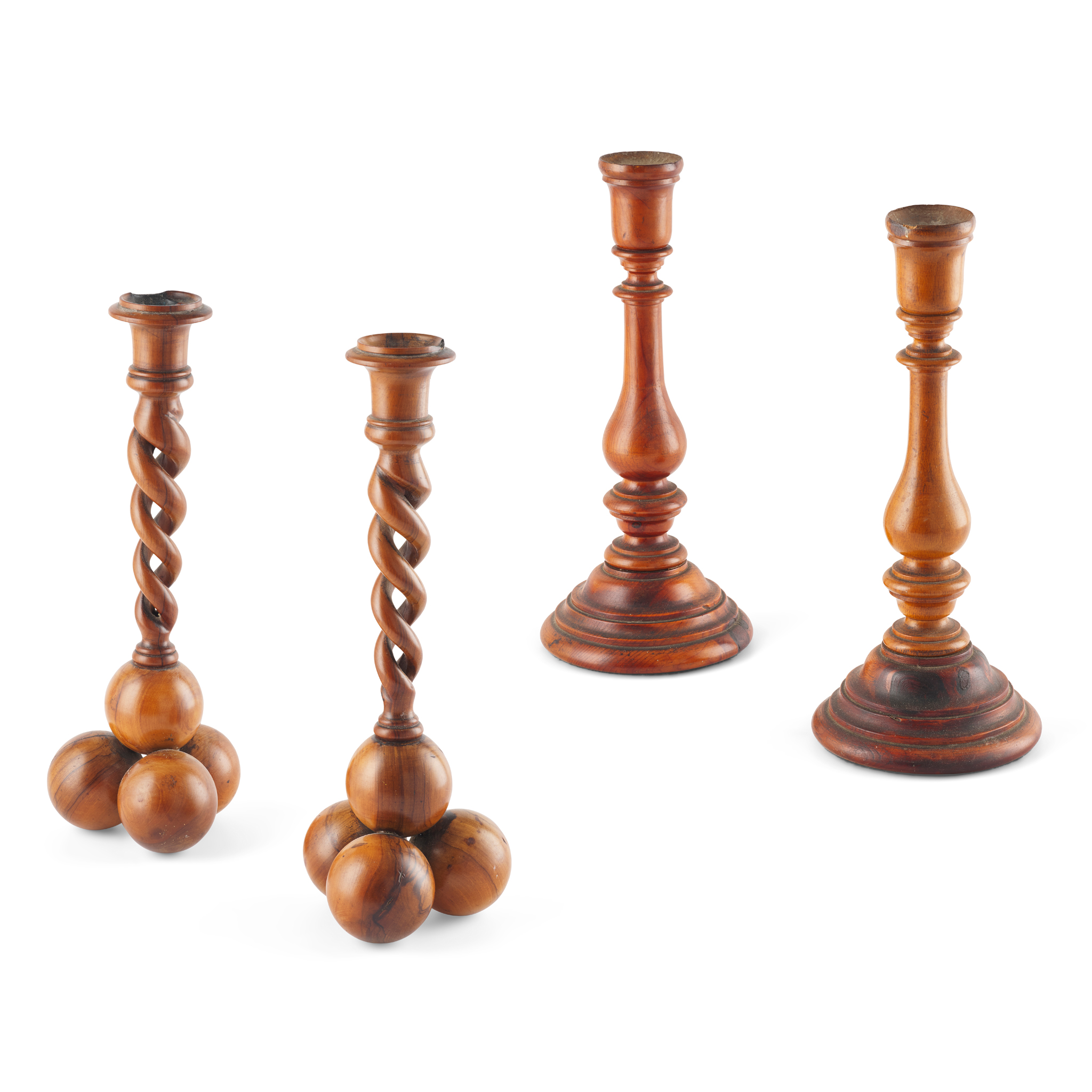 TWO PAIRS OF TREEN CANDLESTICKS