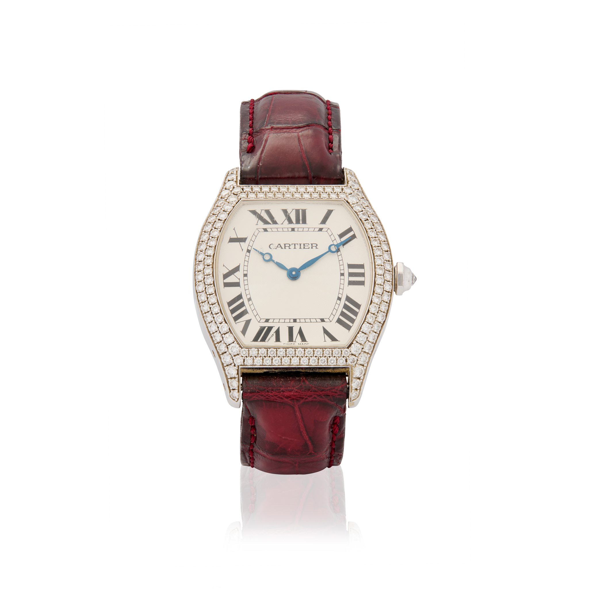 Cartier. A fine 18k white and diamond gold tonneau shape mechanical wristwatch