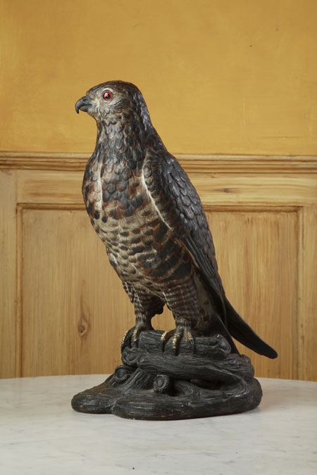 A late 19th/early 20th century Austrian painted terracotta model of a falcon