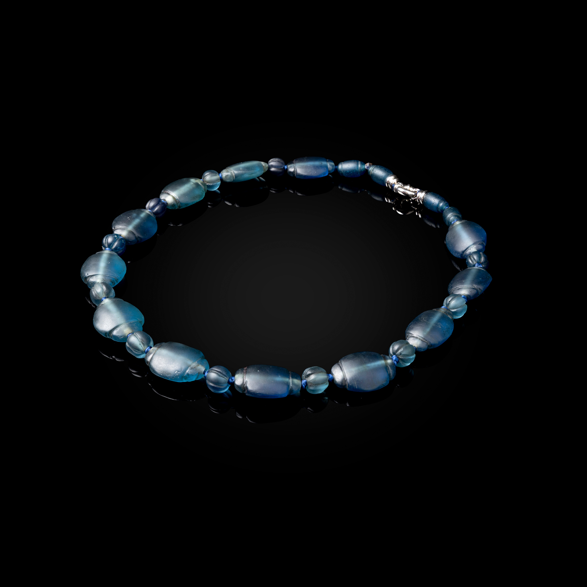 A FATIMID BLUE-GLASS COMPOSITE NECKLACE
