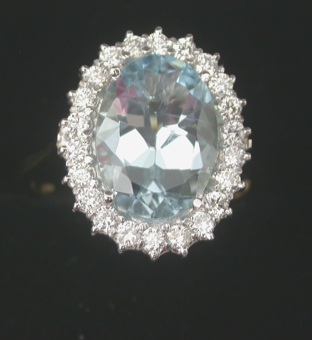 An 18ct gold mounted oval cluster ring,