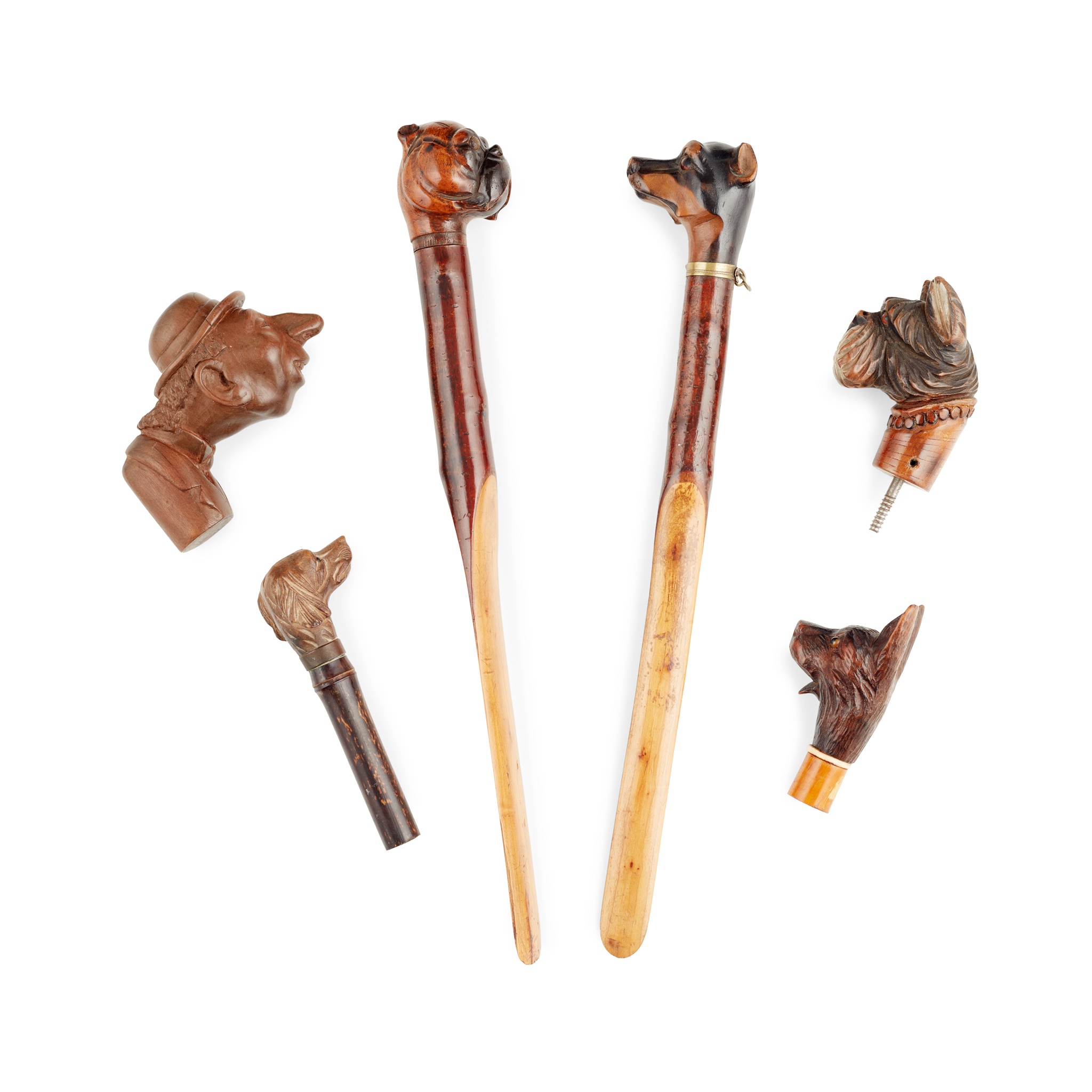 COLLECTION OF CARVED DOG'S HEAD HANDLES