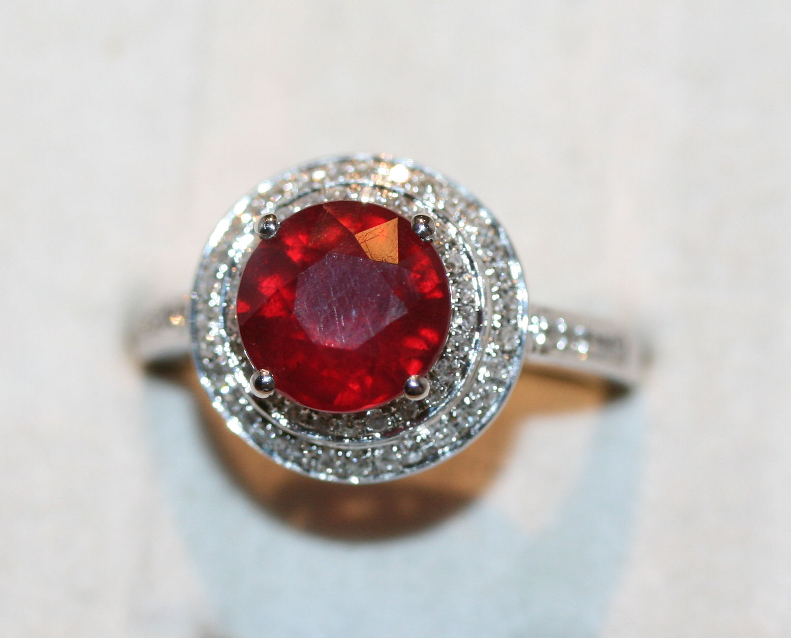A treated ruby and diamond set ring