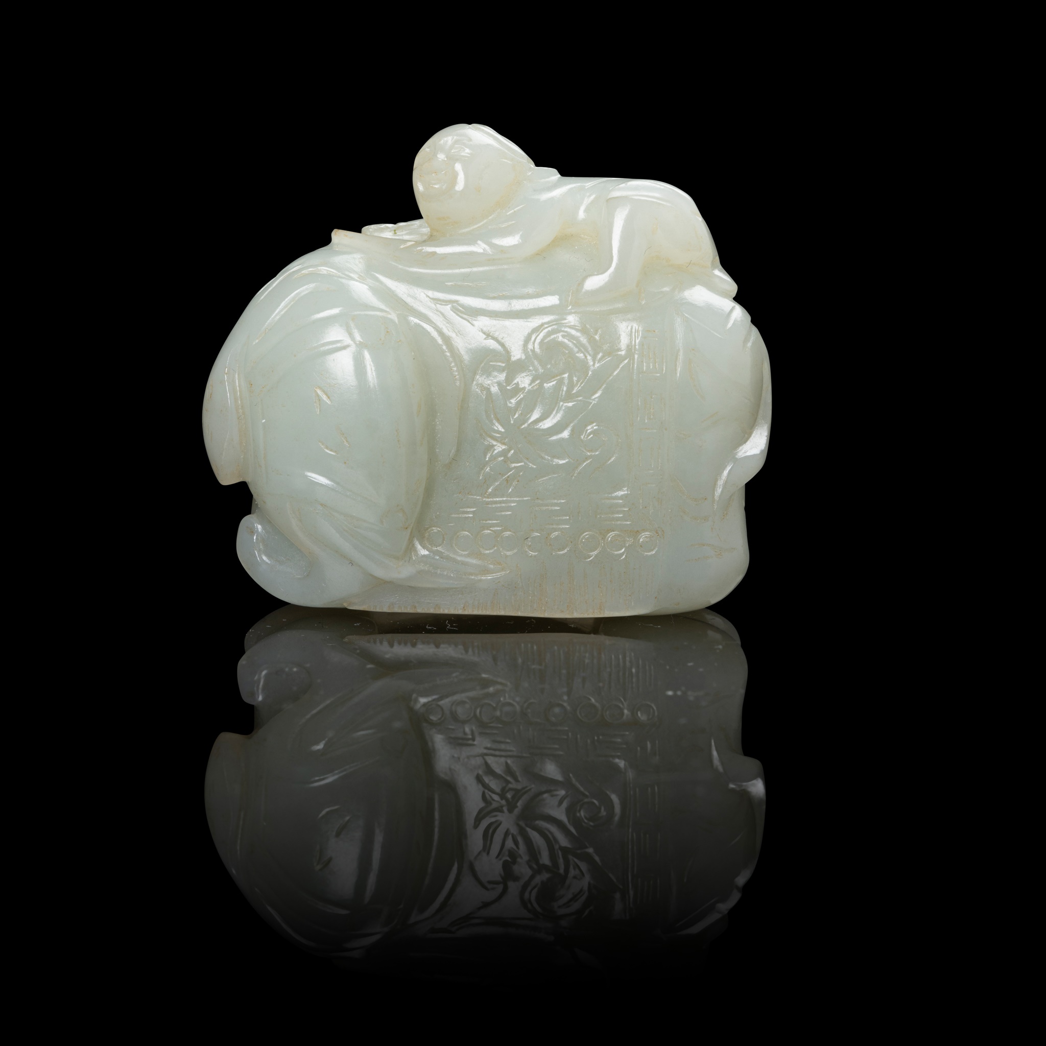 CELADON JADE CARVING OF A BOY ON ELEPHANT