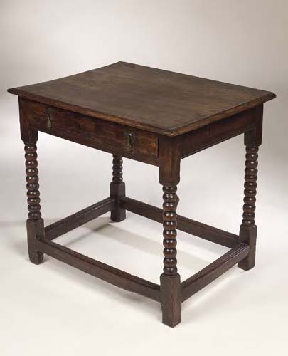 A 17th century oak side table,