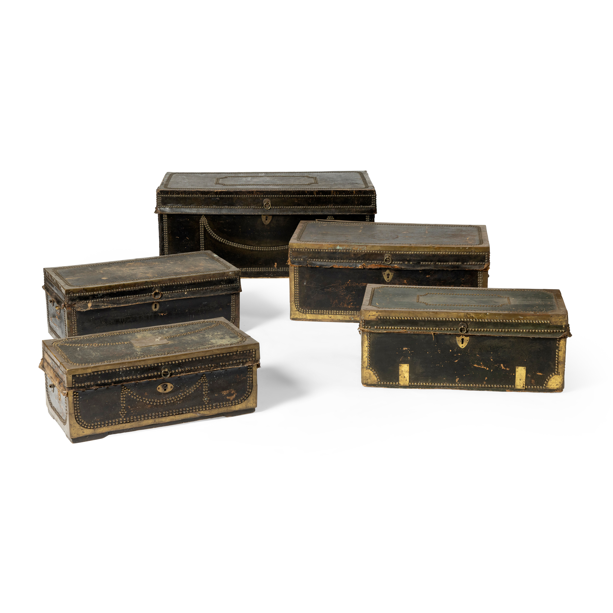 A COLLECTION OF FIVE LEATHER AND BRASS MOUNTED TRUNKS