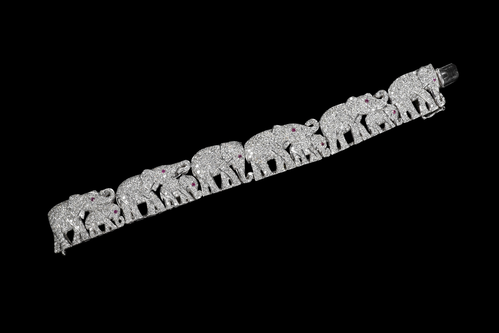A contemporary 18ct white gold diamond and ruby set elephant bracelet