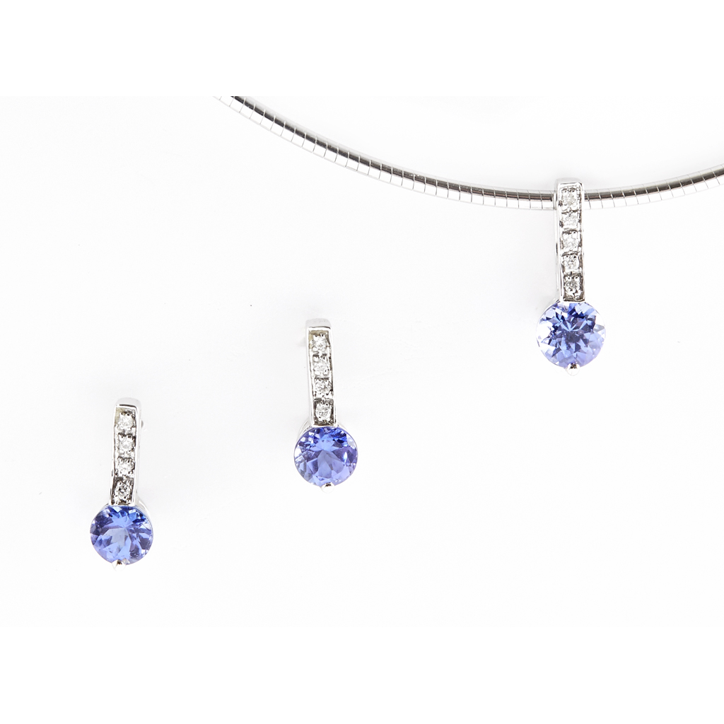 A Tanzanite and diamond set pendant necklace and matching earrings