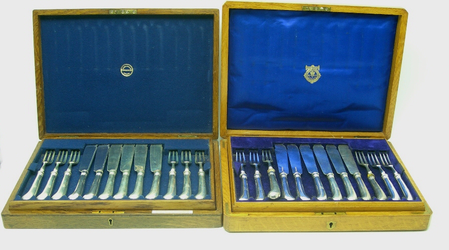 A SET OF TWELVE FISH KNIVES AND FORKS