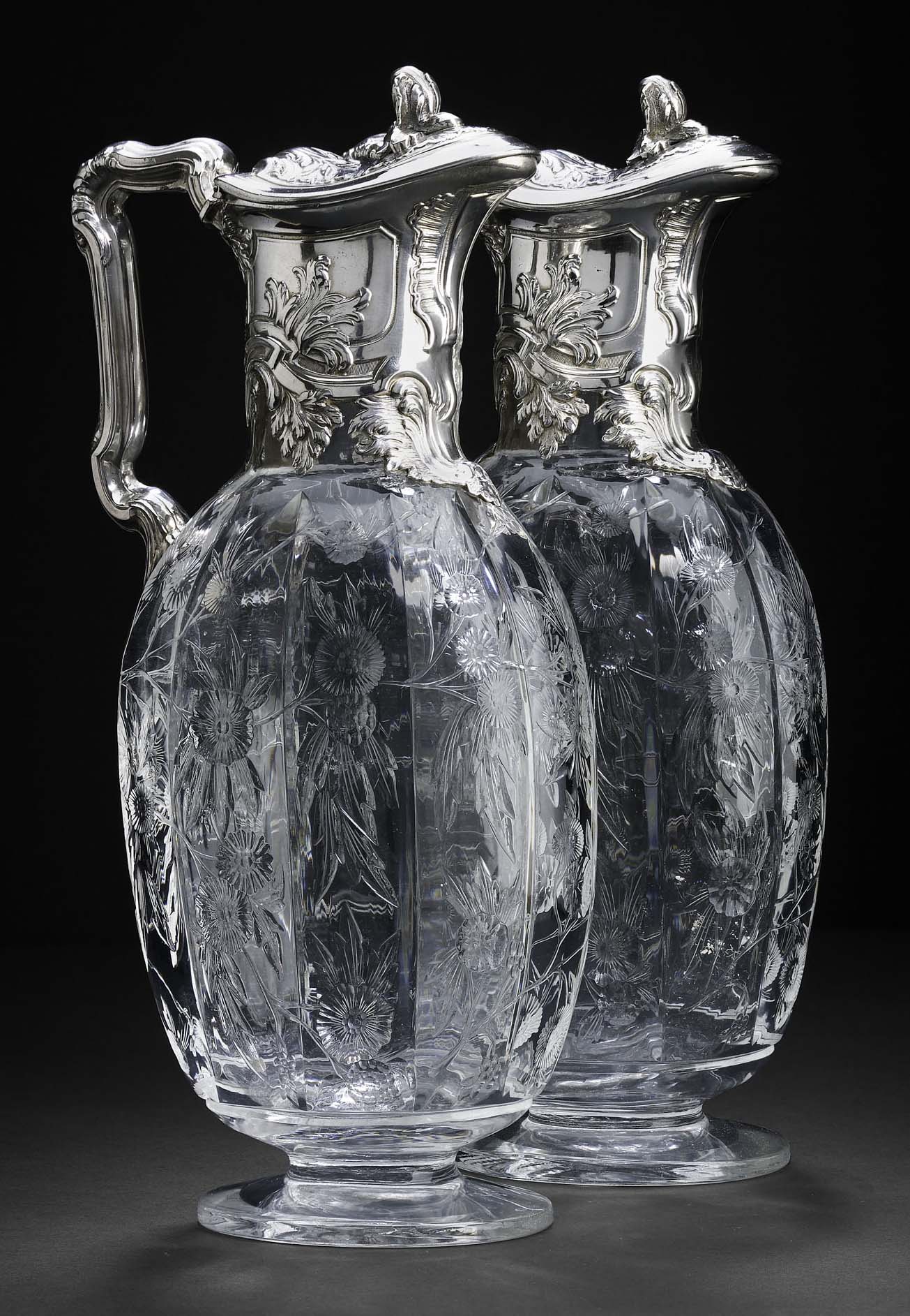 A pair of Victorian silver-mounted claret jugs