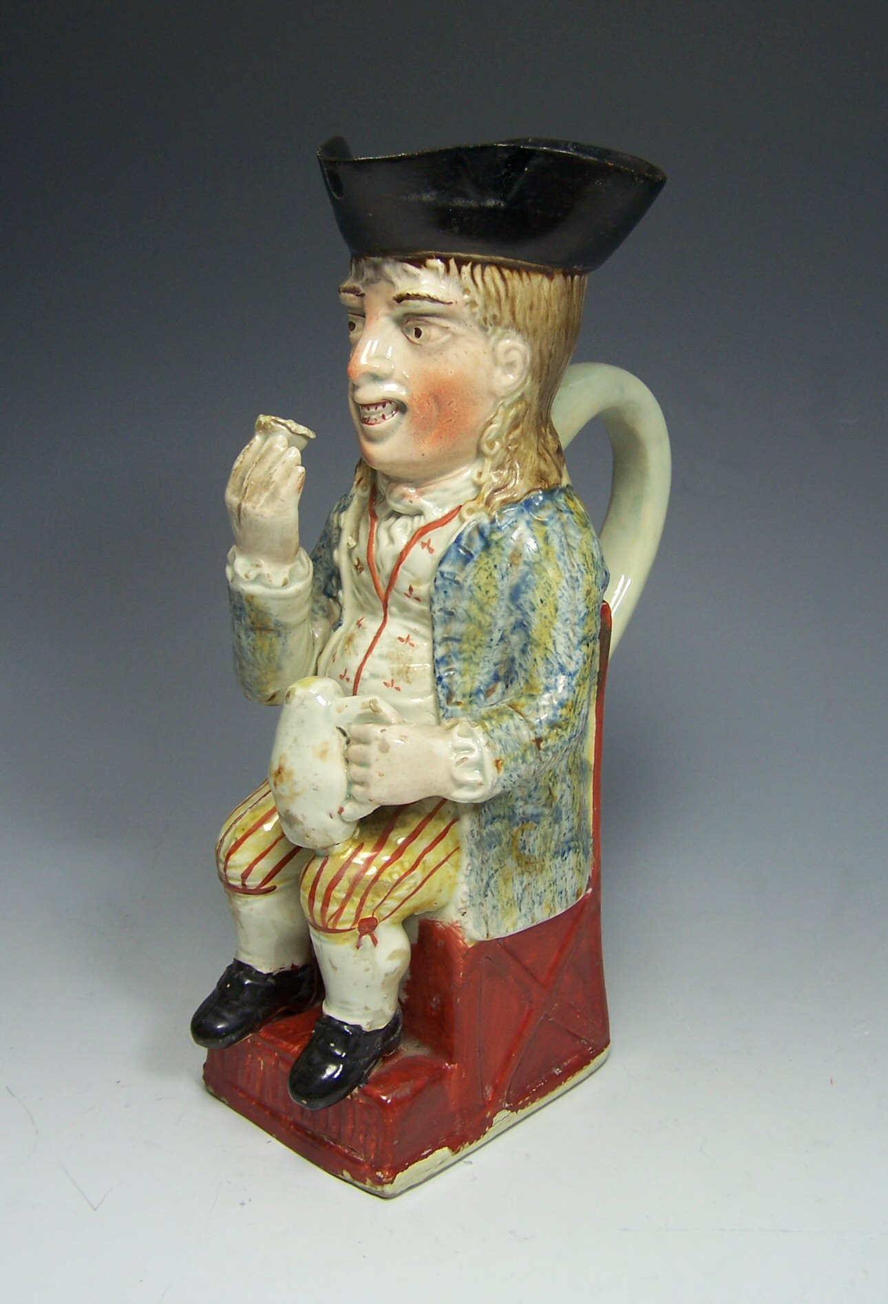 An early 19th century Staffordshire toby jug