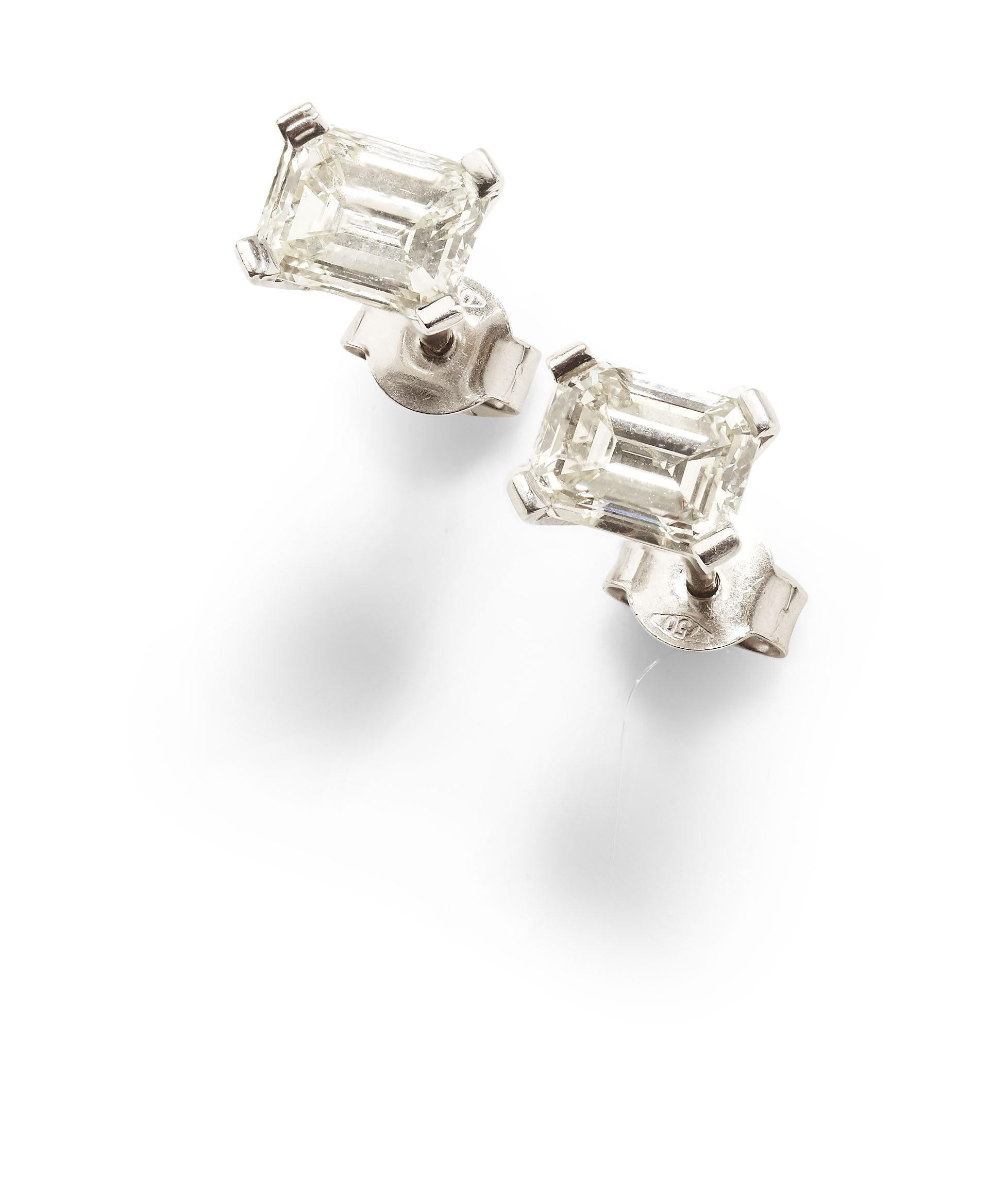 A pair of platinum mounted diamond earrings,