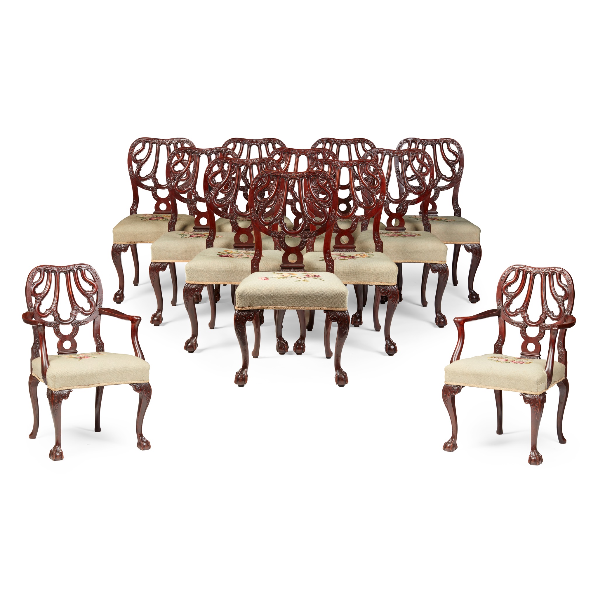 SET OF TWELVE GEORGE II STYLE CARVED MAHOGANY DINING CHAIRS, TO A DESIGN BY GILES GRENDEY, BY R. STRAHAN, DUBLIN
