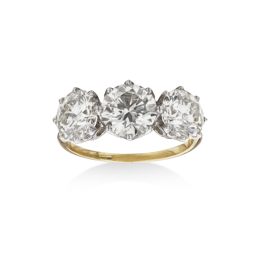 A three stone diamond set ring