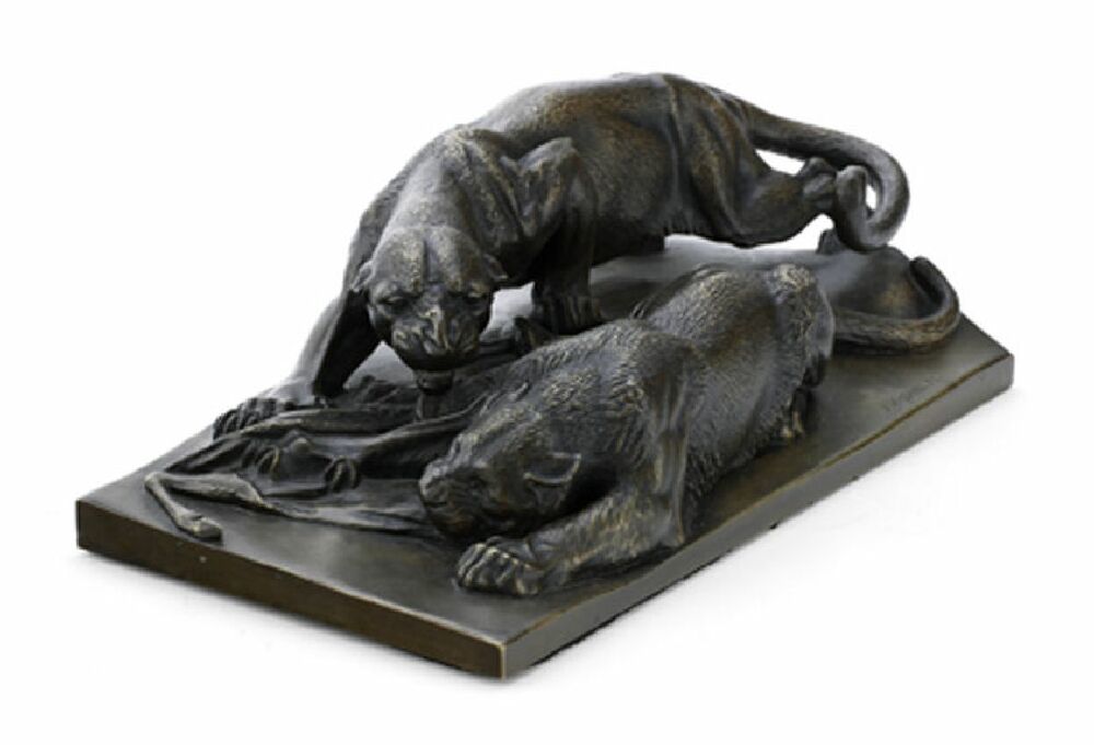 A late 19th century German bronze sculpture of lions at a kill After Julius Heinrich Haehnel (1823-1909)