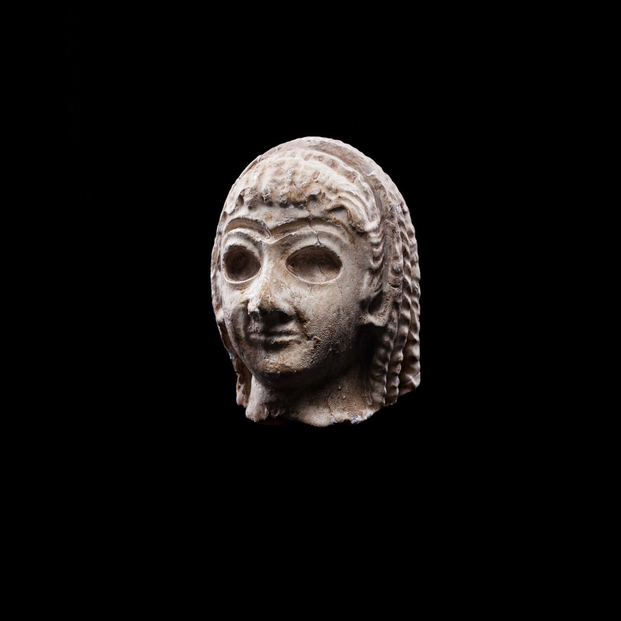SUMERIAN HEAD OF A FEMALE WORSHIPPER