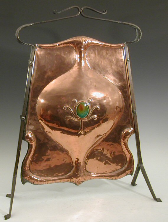 An Arts and Crafts wrought iron and copper firescreen,