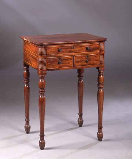 An early 19th century mahogany work table