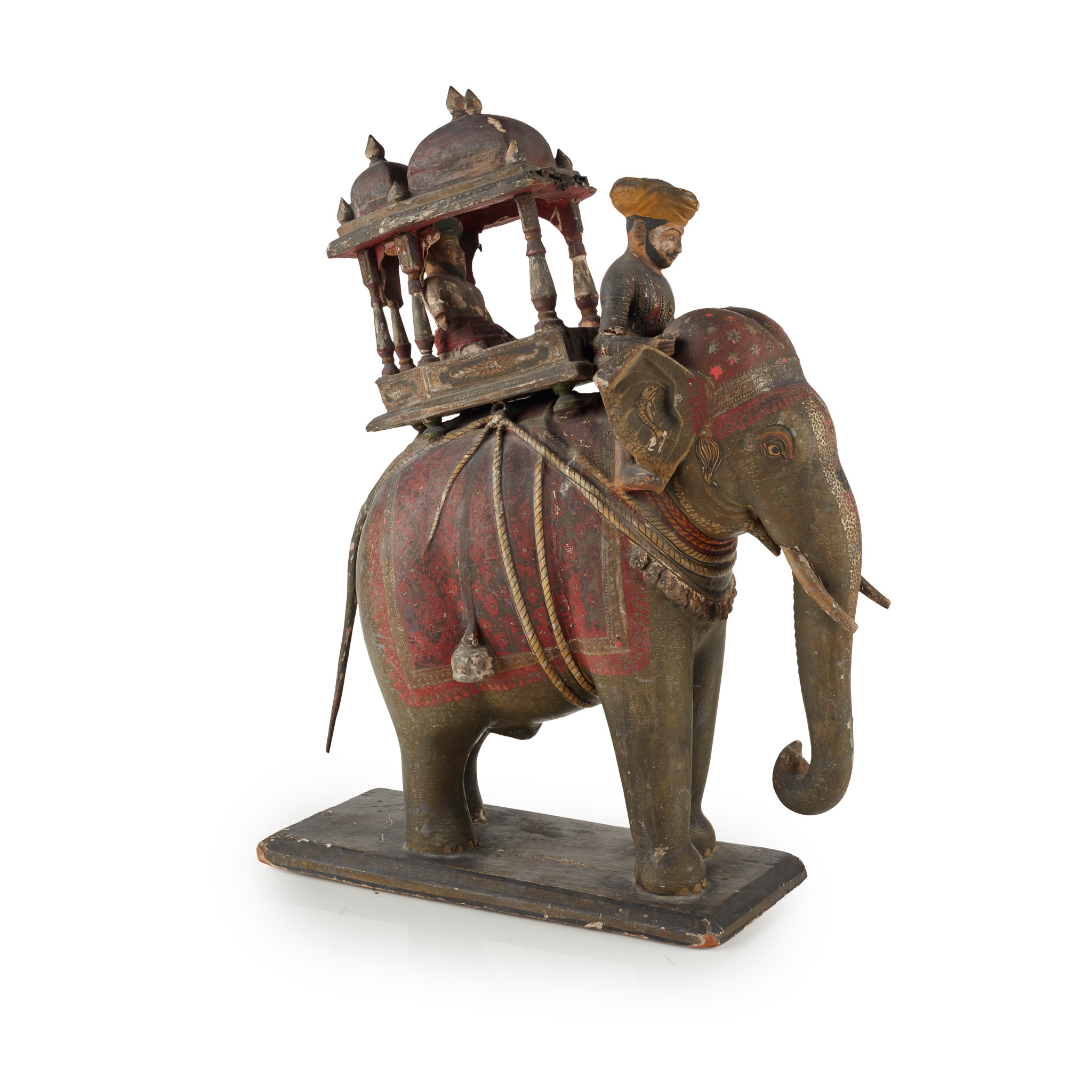 AN INDIAN CARVED AND PAINTED WOOD AND GESSO MODEL OF AN ELEPHANT AND HOWDAH