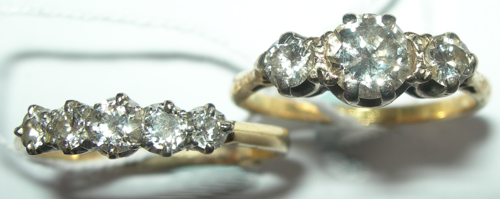 An 18ct gold mounted diamond three-stone ring,