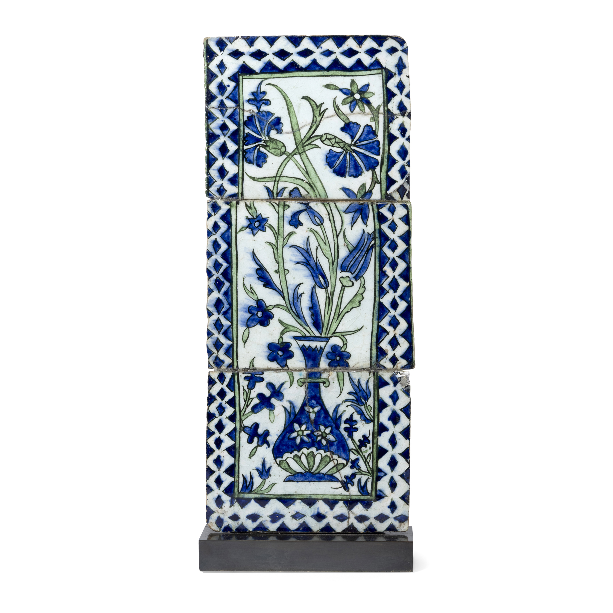 A DAMASCUS POTTERY TILE PANEL DEPICTING A VASE AND FLOWERS