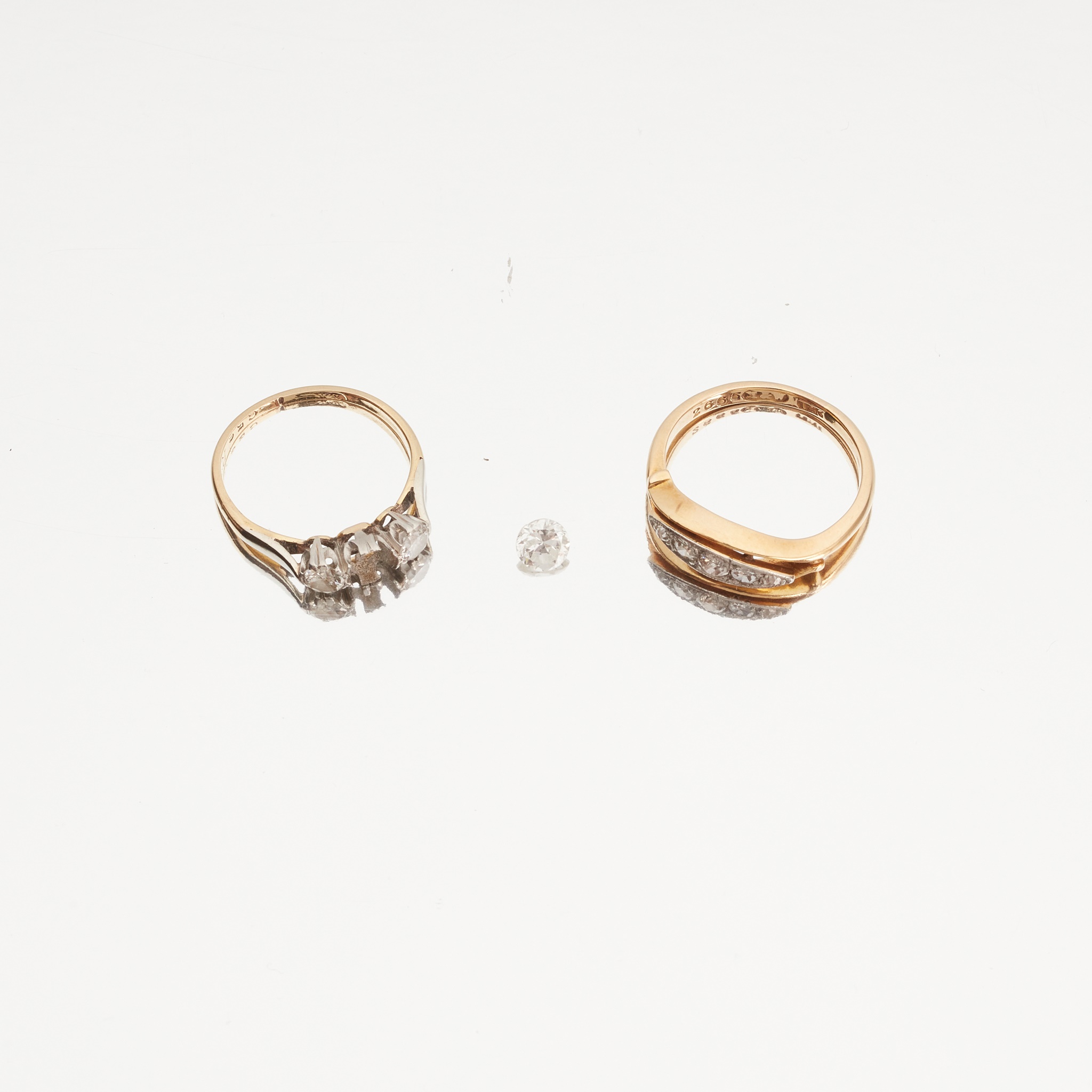 A three stone diamond set ring