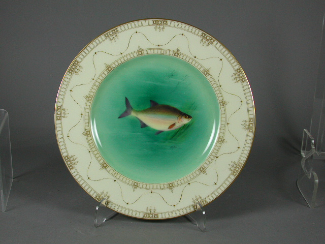 A set of six Coalport circular scalloped plates